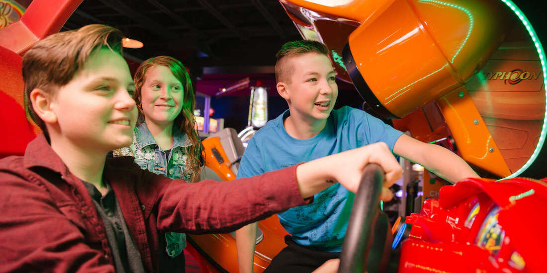 Kids play games and eat cake at Andy B's, one of Tulsa's best kids birthday party places.