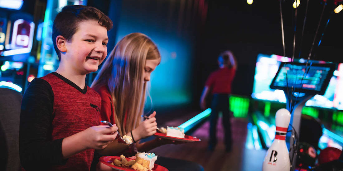 Kids play games and eat cake at Andy B's, one of Tulsa's best kids birthday party places.