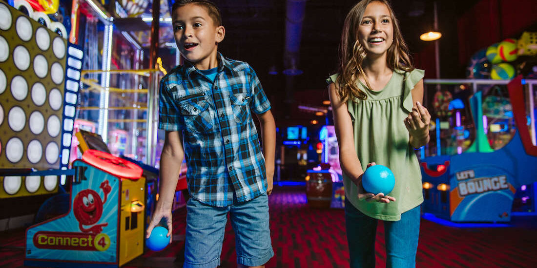 Kids play games and eat cake at Andy B's, one of Tulsa's best kids birthday party places.